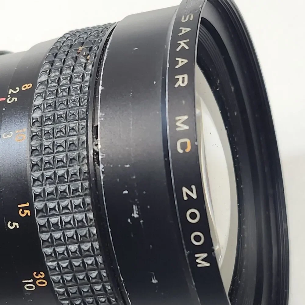 Canon AE-1 Black 35mm SLR Film Camera Sakar MC Zoom 1:3.5-4.5 f 28-80mm